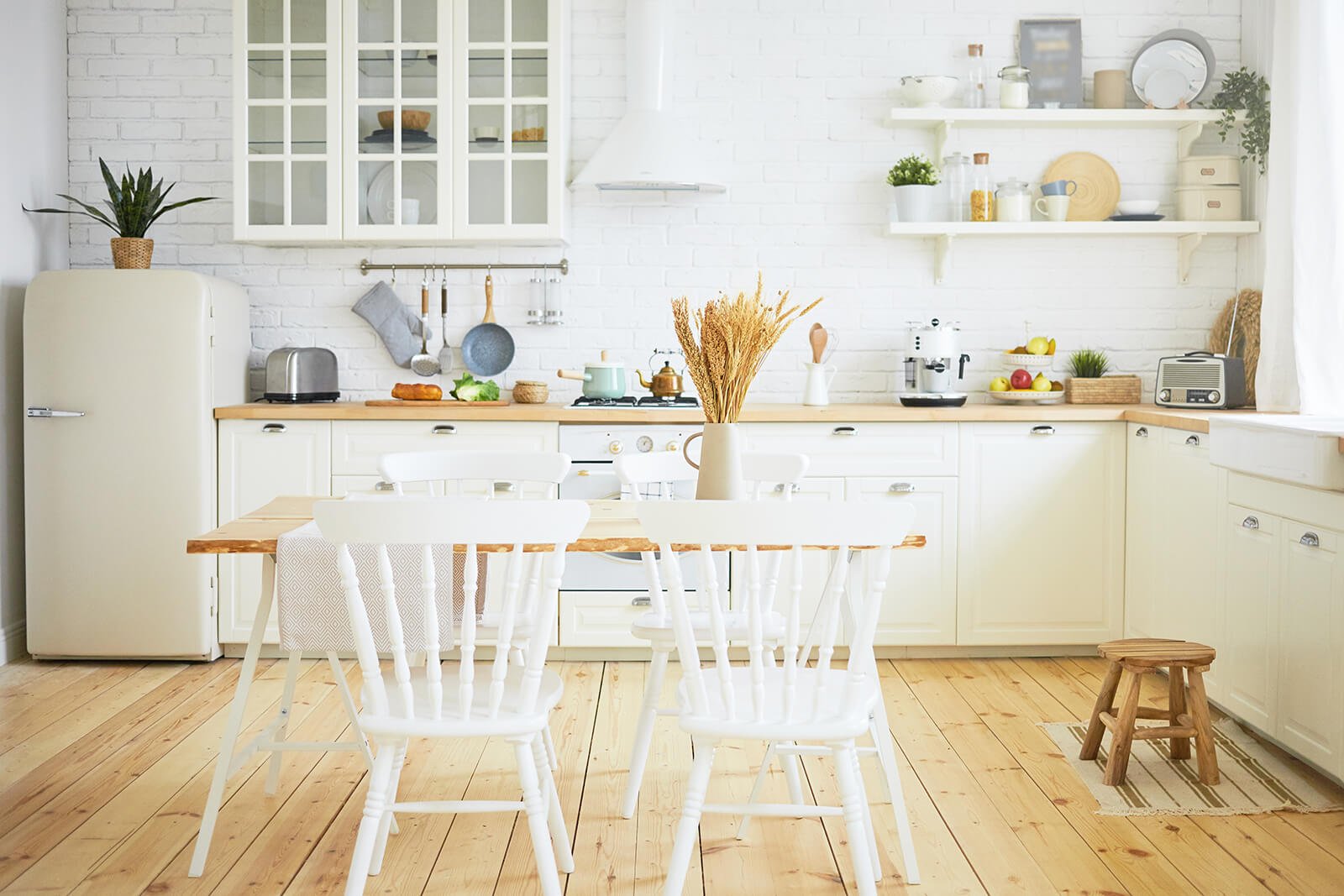 stylish-scandinavian-kitchen-interior-chairs-table-foreground-fridge-long-wooden-counter-with-machines-utensils-shelves-interiors-design-ideas-home-coziness-concept (2) (1)
